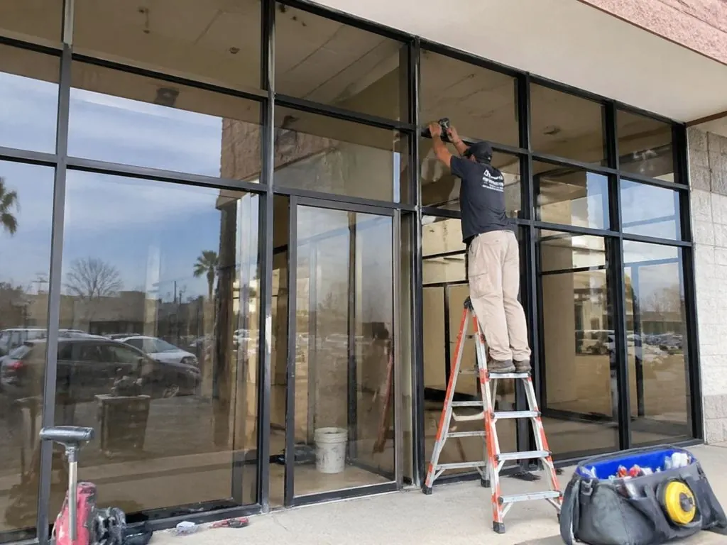 Glass and aluminum commercial entrance system